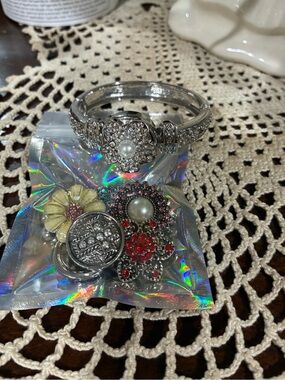 Silver Floral Pearl Accent Bracelet with Assorted Decorative Charms